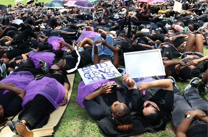 Protesters observe 15 minutes of silence at the Union Buildings in Pretoria on 21 November 2024, lying on the ground to honour the 15 women killed daily in South Africa. Photo: UN Women/Maphuti Mahlaba