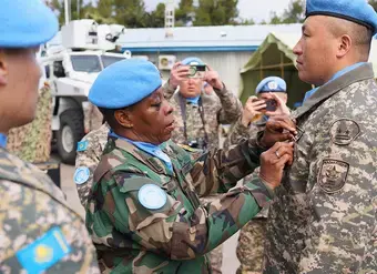 Head of Mission and Force Commander Major General Anita Asmah presents the first Kazakhstan contingent at UNDOF with their UNDOF medals on 7 February 2025. Photo: UNDOF